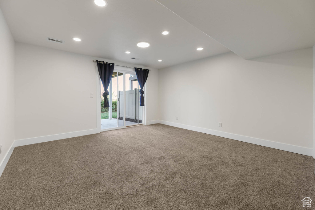 Spare room with recessed lighting and carpet flooring