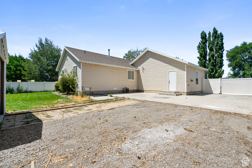 Back of property with a patio and a fenced backyard