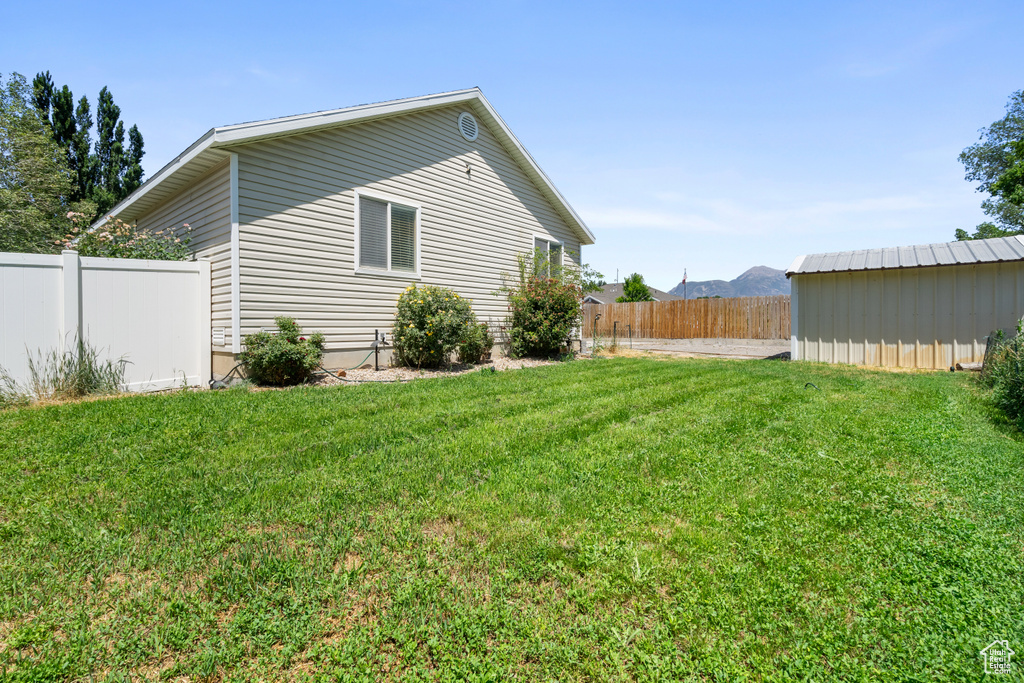 View of property exterior with a fenced backyard