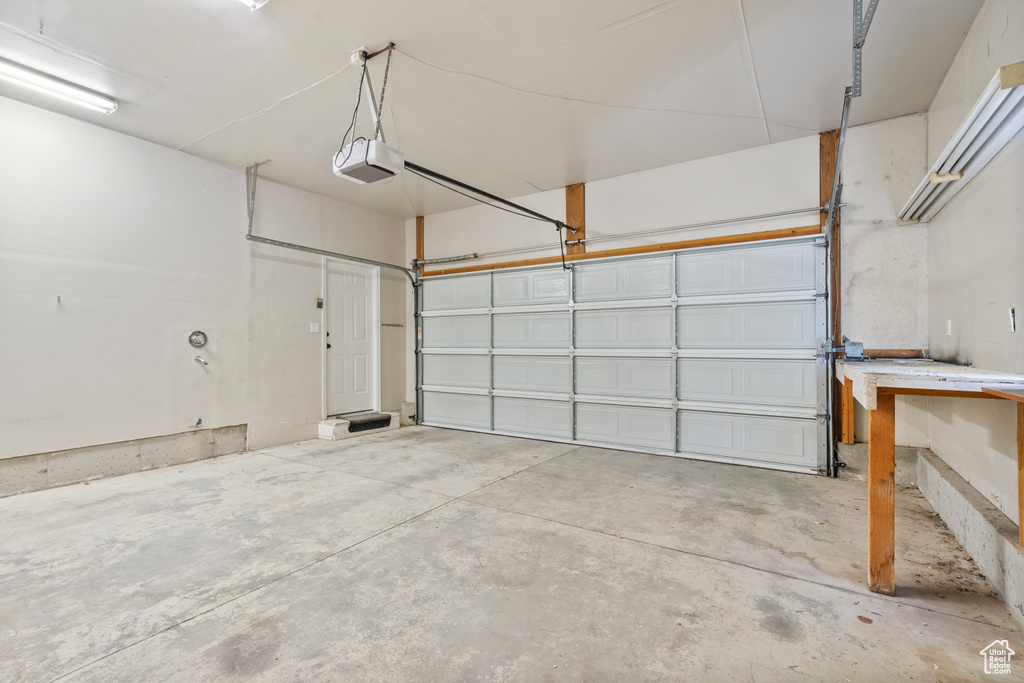 Garage featuring a garage door opener