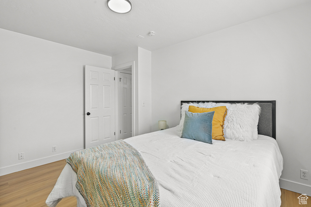 Bedroom with wood finished floors