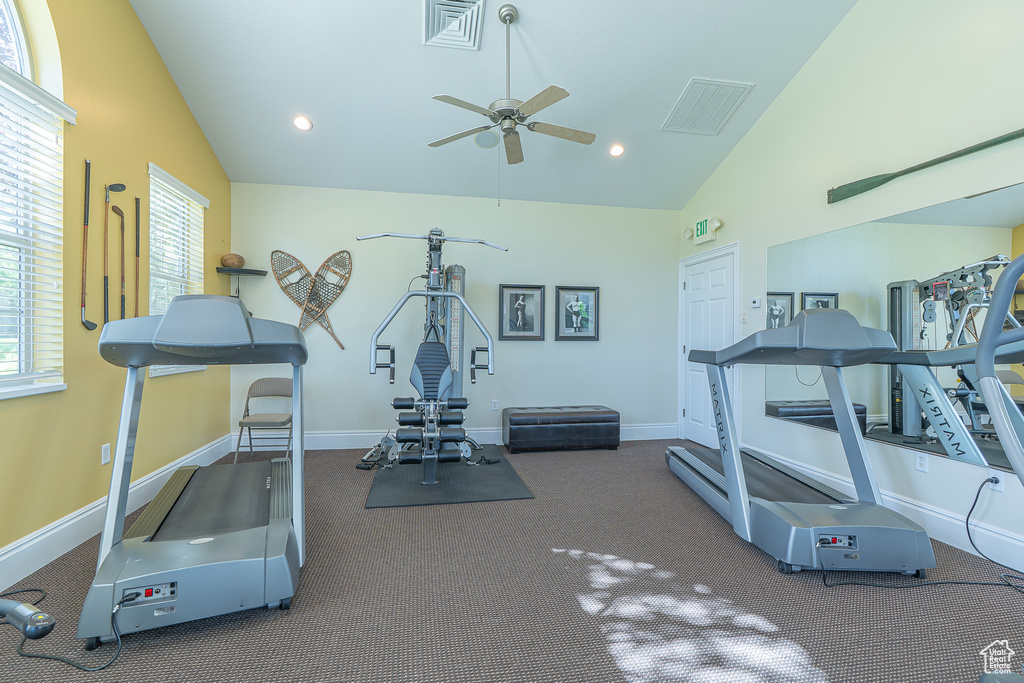 Exercise area with a ceiling fan, high vaulted ceiling, carpet flooring, and recessed lighting