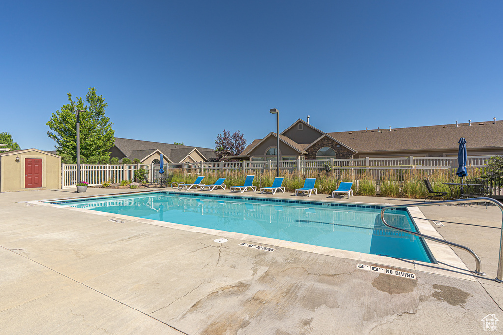 Community pool featuring a patio area