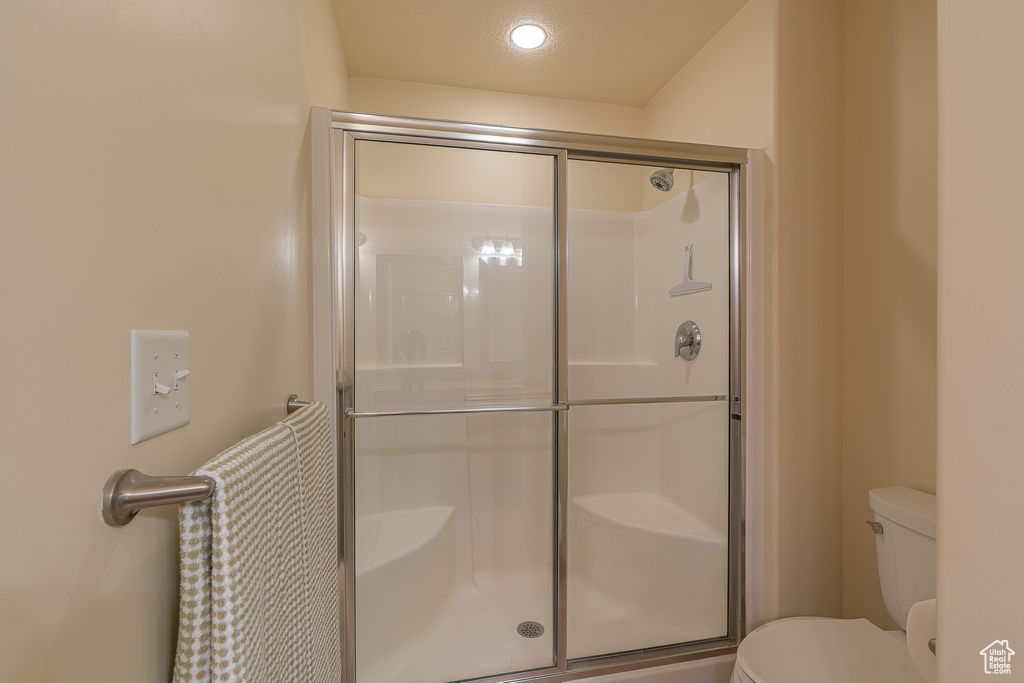 Full bathroom featuring a stall shower and recessed lighting