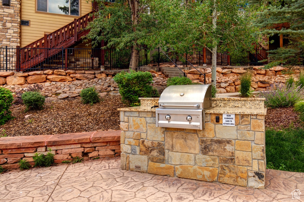 View of patio / terrace featuring exterior kitchen and stairway