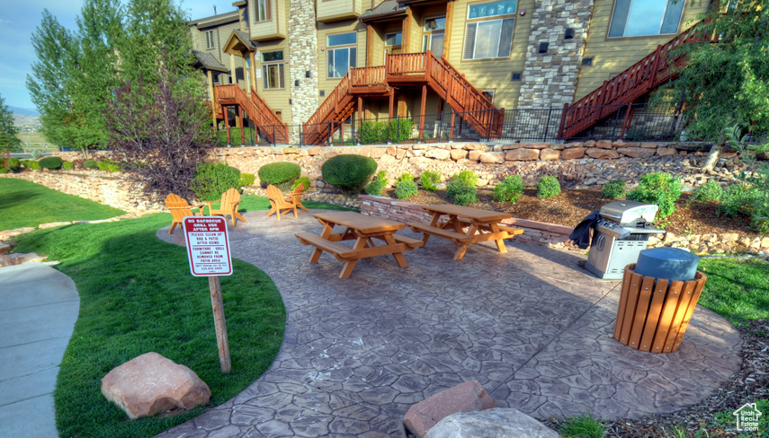 View of patio / terrace with stairs and a grill