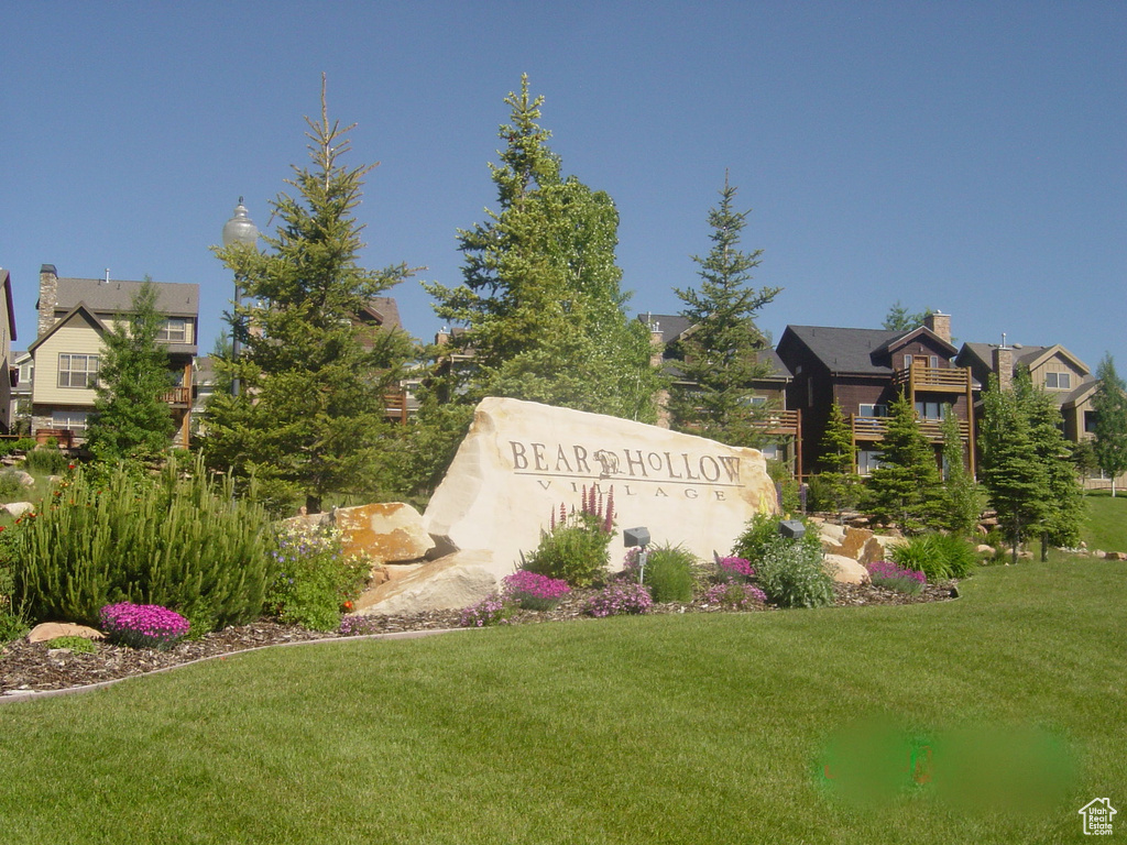Community / neighborhood sign with a lawn