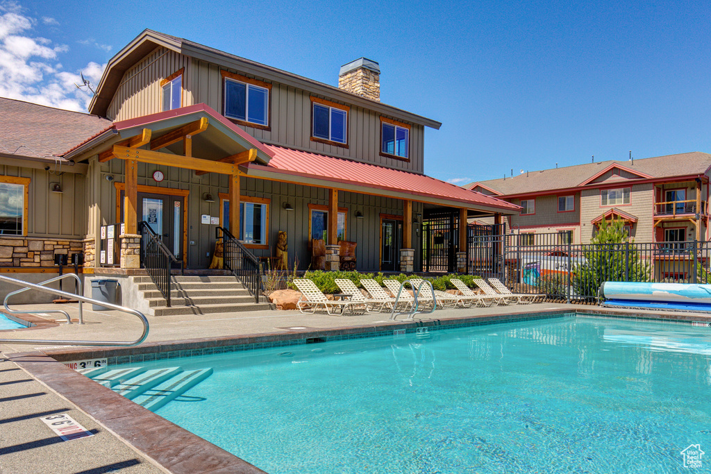 Community pool featuring a patio