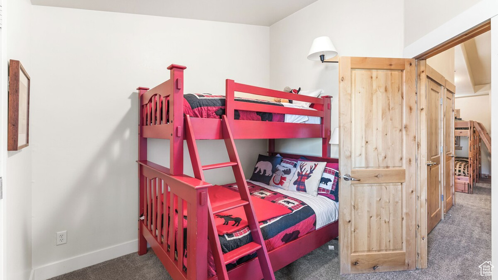Bedroom with carpet and baseboards