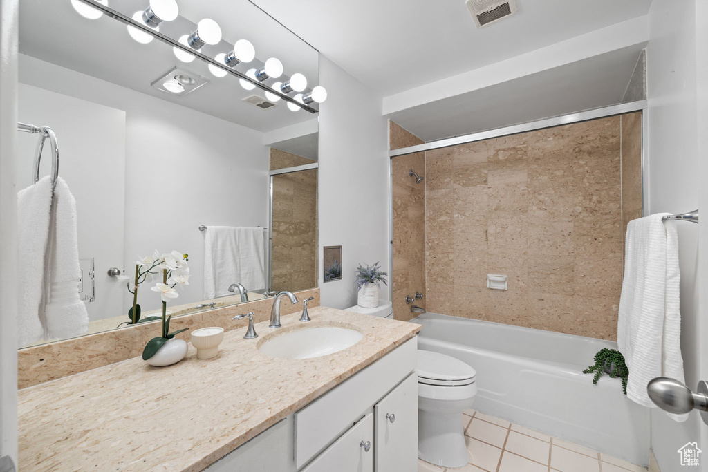 Bathroom with tile patterned floors, vanity, and bathing tub / shower combination