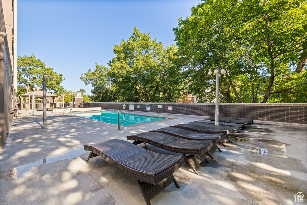 Community pool featuring a patio