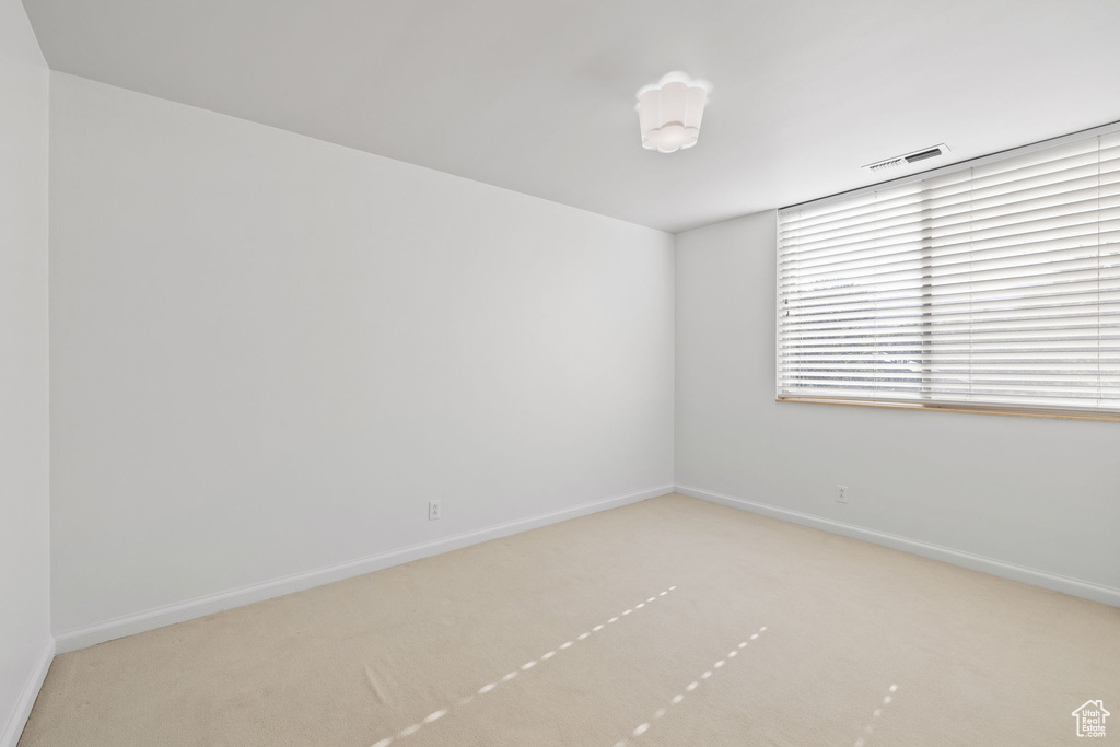 Unfurnished room with carpet floors