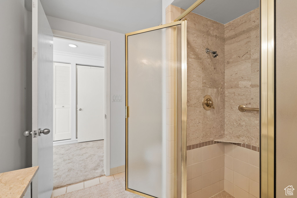 Full bath featuring a shower stall, tile patterned floors, vanity, and recessed lighting