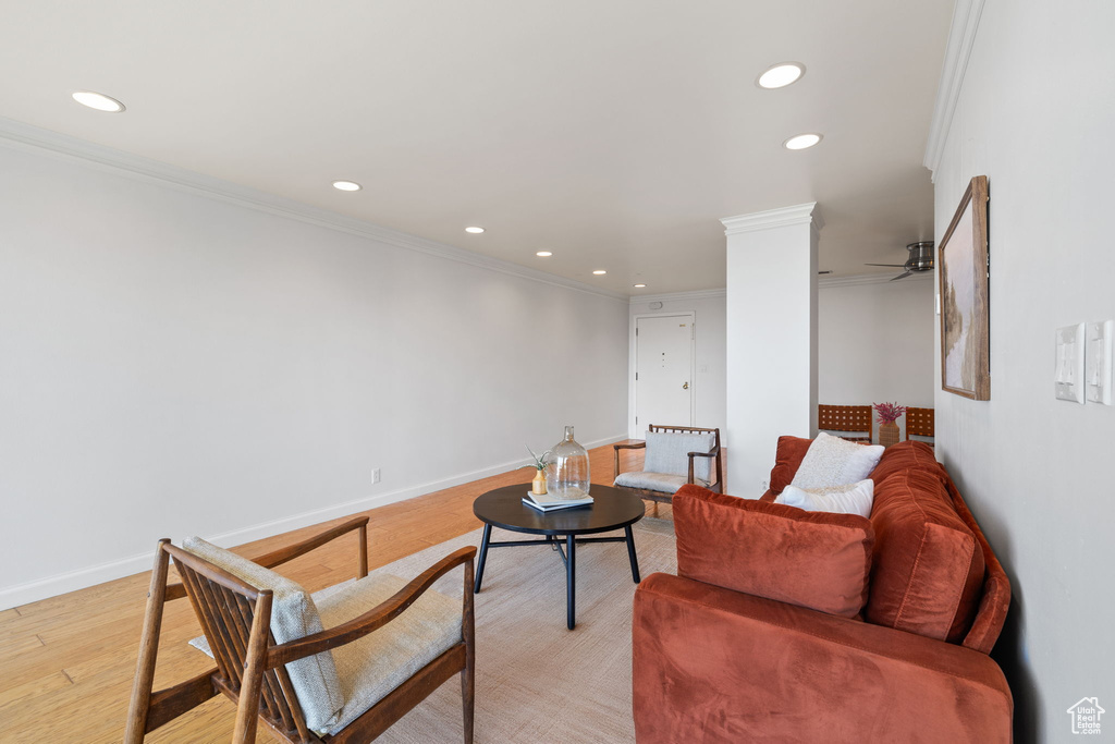 Living area featuring ornamental molding, recessed lighting, light wood-style floors, and a ceiling fan
