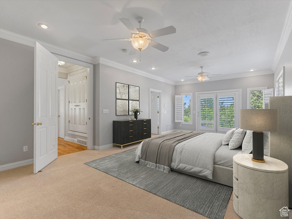 Bedroom featuring recessed lighting, light colored carpet, crown molding, and a ceiling fan