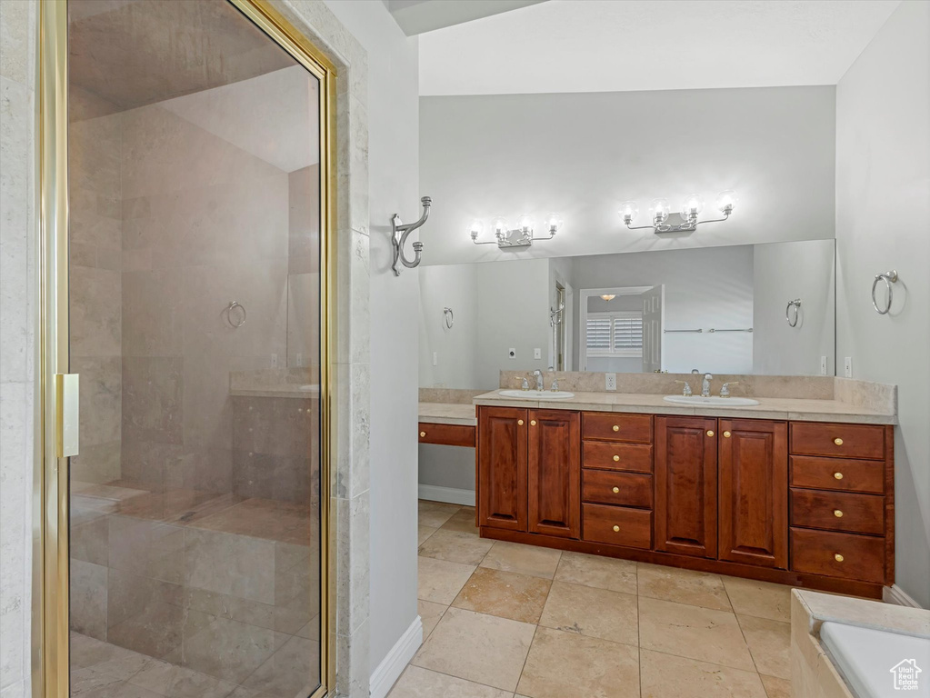 Bathroom with double vanity and a stall shower