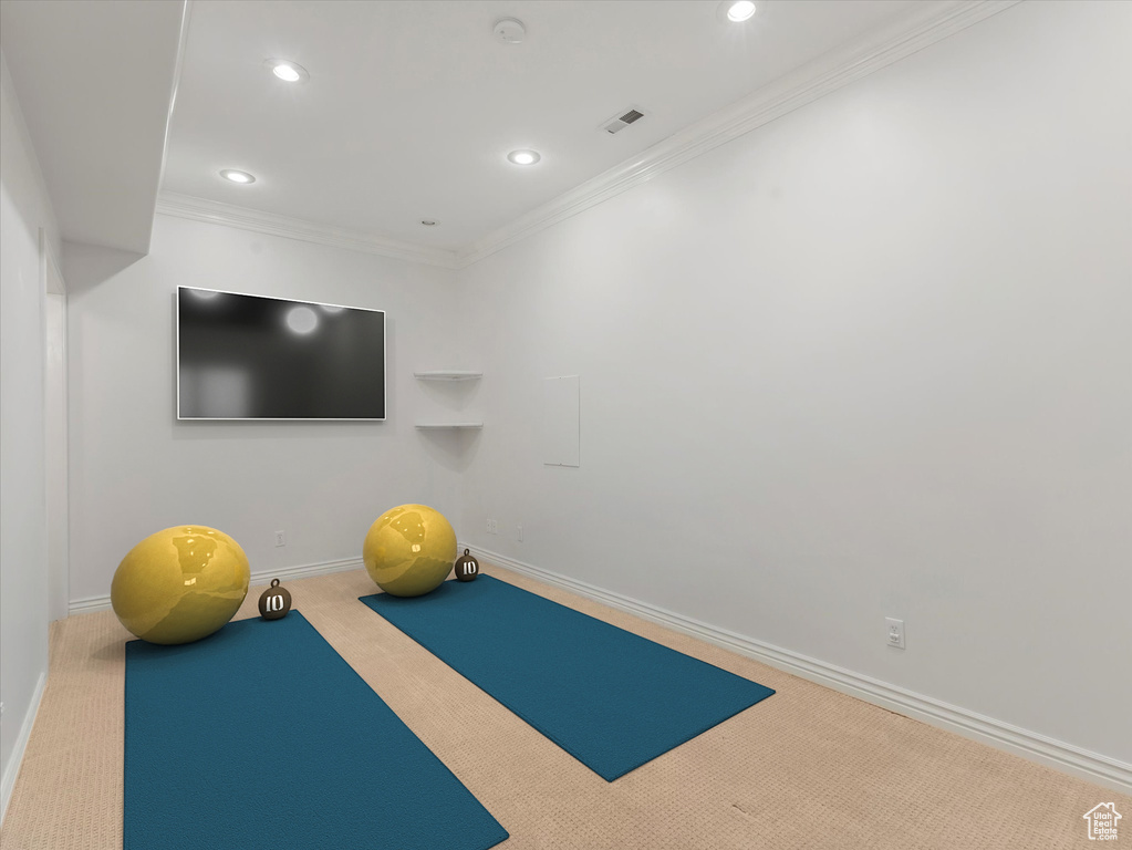 Exercise room featuring carpet, recessed lighting, and crown molding