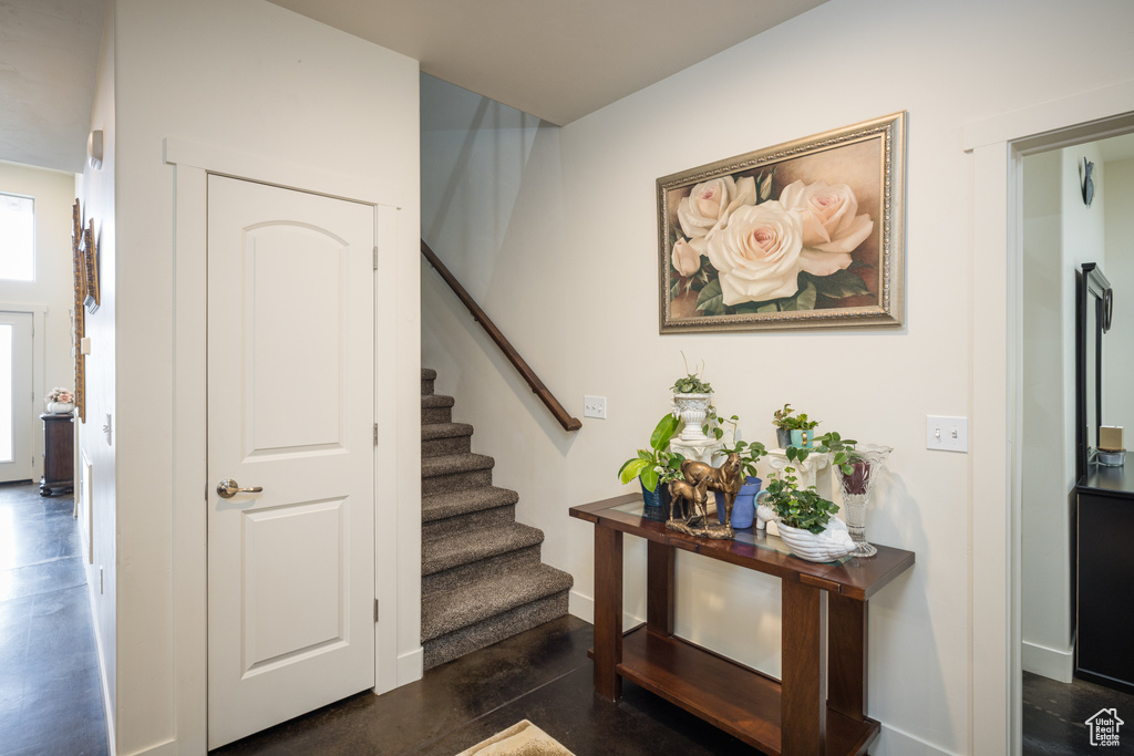 Staircase featuring baseboards