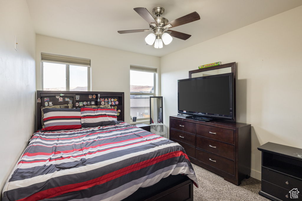 Bedroom featuring carpet flooring and ceiling fan