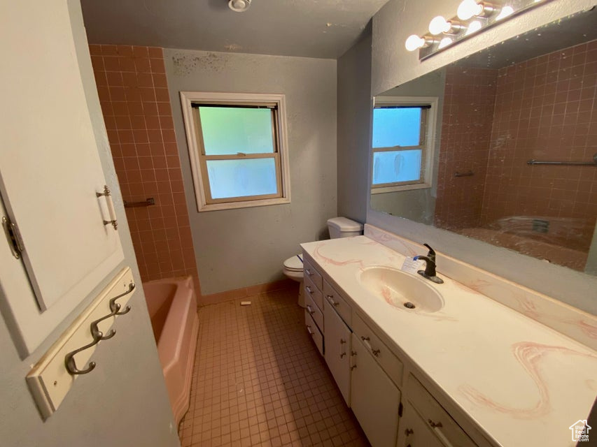 Bathroom with vanity and tile patterned floors