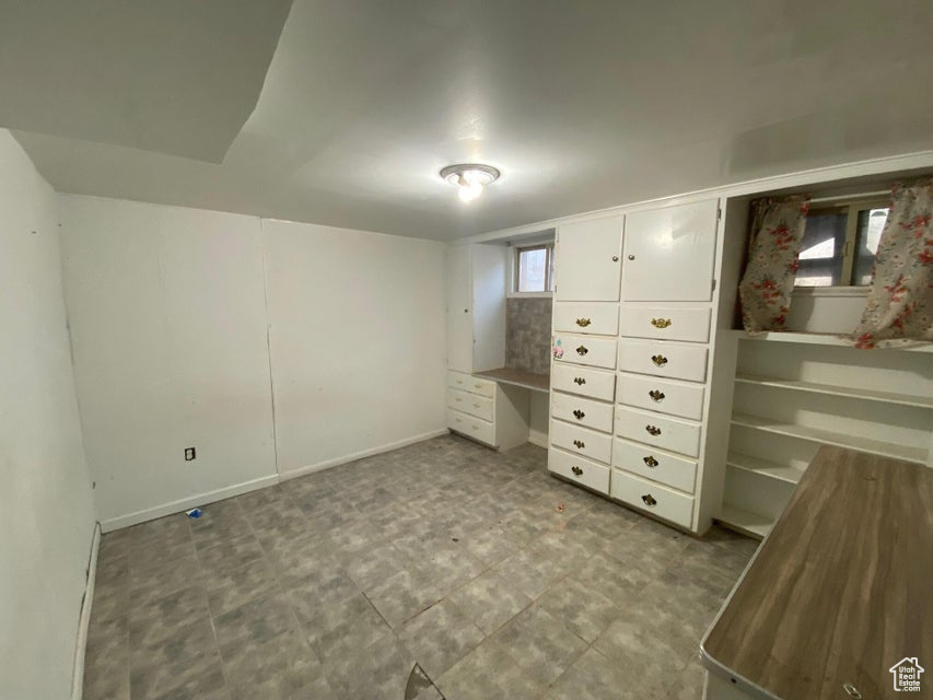 Unfurnished bedroom featuring baseboards