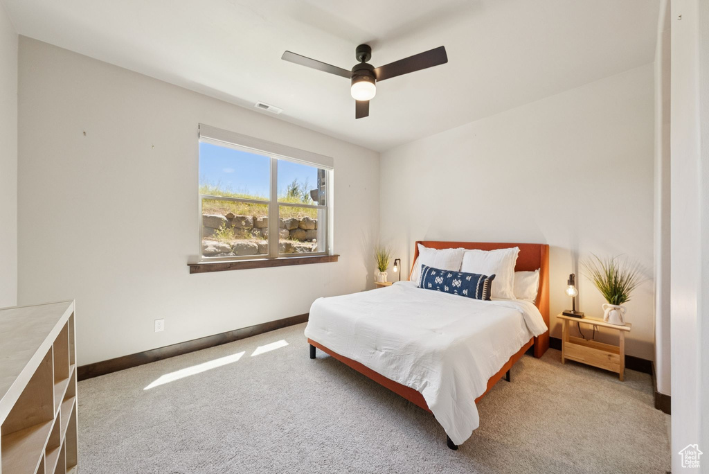 Bedroom with carpet and ceiling fan