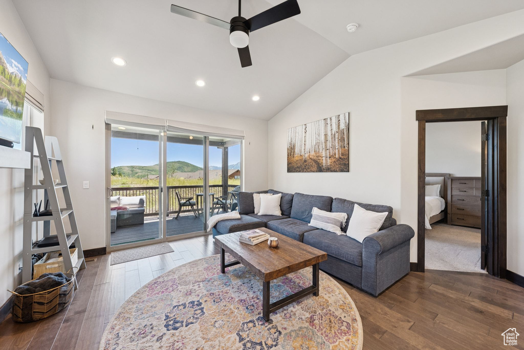 Living room featuring ceiling fan, vaulted ceiling, dark wood finished floors, and recessed lighting