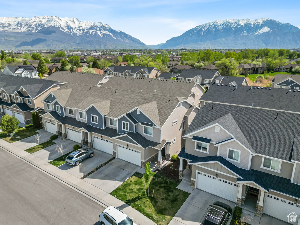 Aerial perspective of suburban area with a mountain backdrop