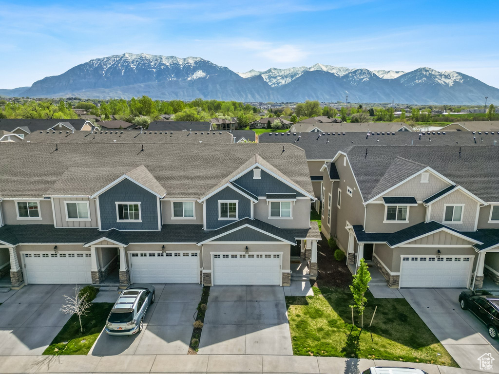 View of mountain backdrop featuring nearby suburban area