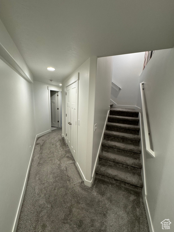 Hall with carpet flooring, stairway, and recessed lighting