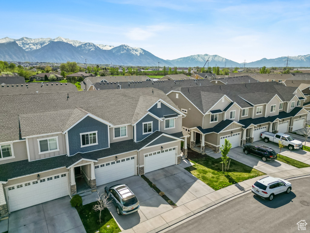 Aerial perspective of suburban area with a mountainous background