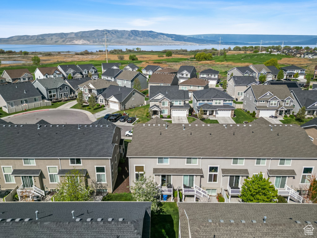 Aerial perspective of suburban area with a water and mountain view