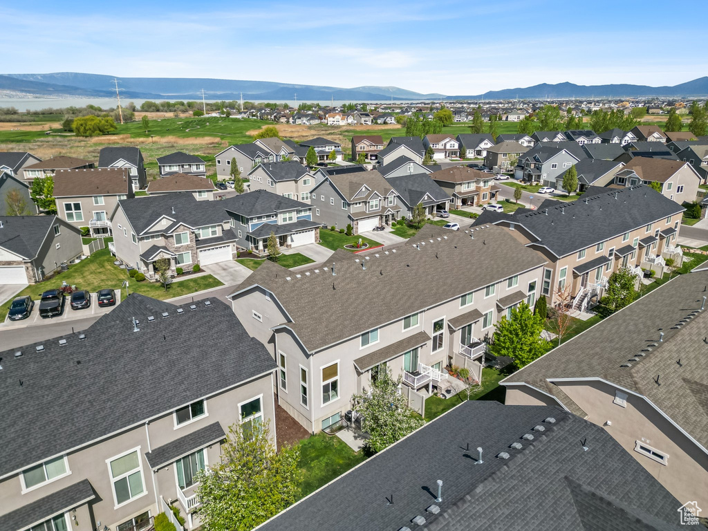 Aerial perspective of suburban area featuring a mountainous background