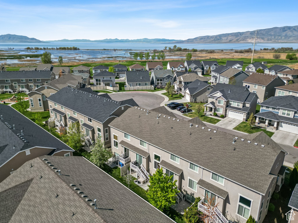 Aerial perspective of suburban area with a water and mountain view