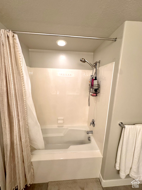 Full bathroom featuring shower / tub combo with curtain and recessed lighting