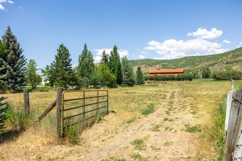 View of yard with a view of countryside and a mountain view