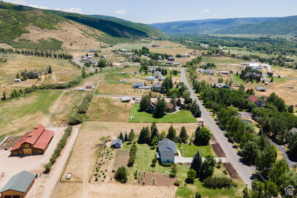 Overview of rural landscape featuring a mountain backdrop