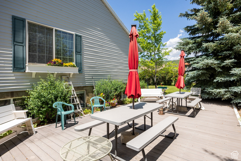 Wooden terrace with outdoor dining area