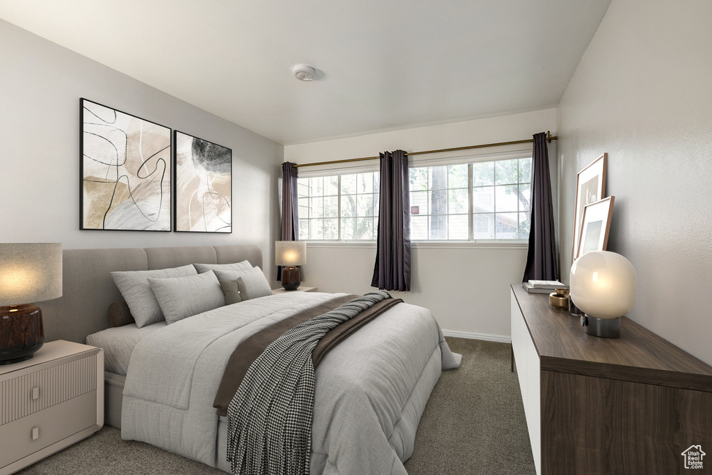 Carpeted bedroom with baseboards