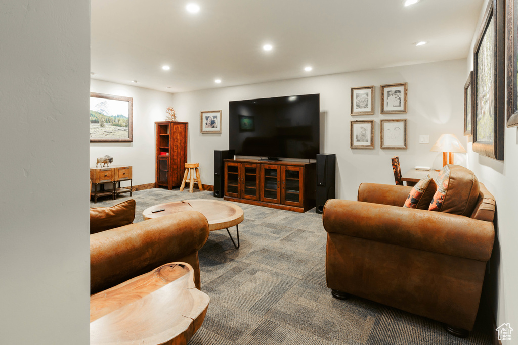 Living room with recessed lighting and carpet flooring