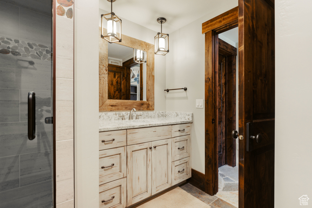 Bathroom featuring vanity and a shower stall