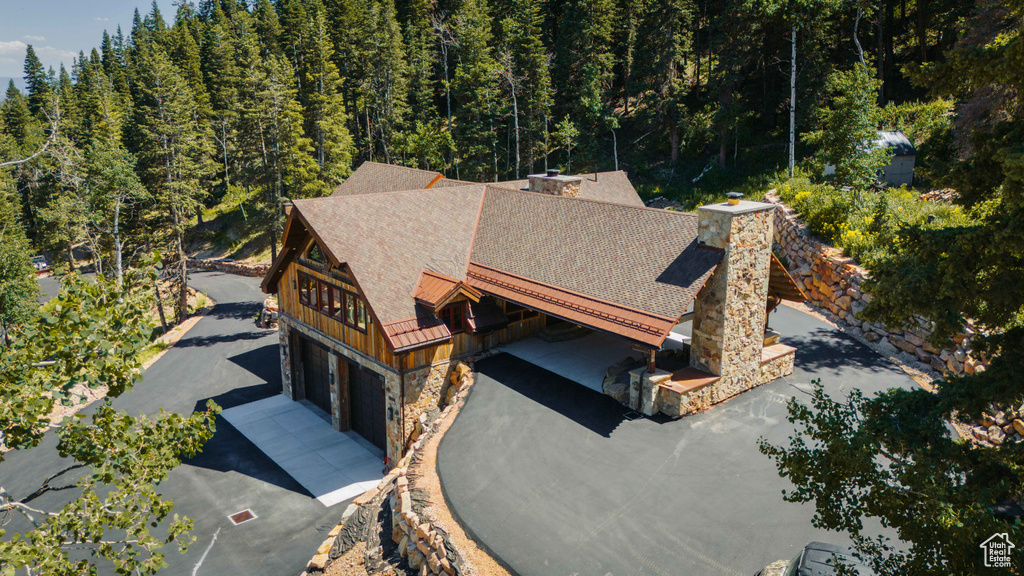 View from above of property featuring a heavily wooded area