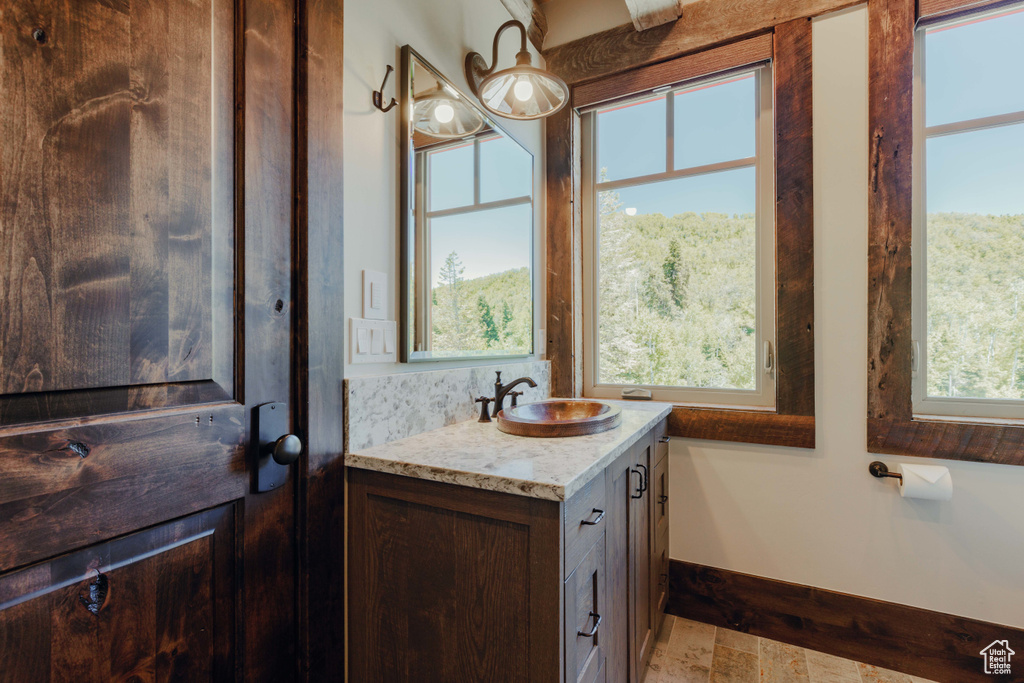 Bathroom with vanity and plenty of natural light