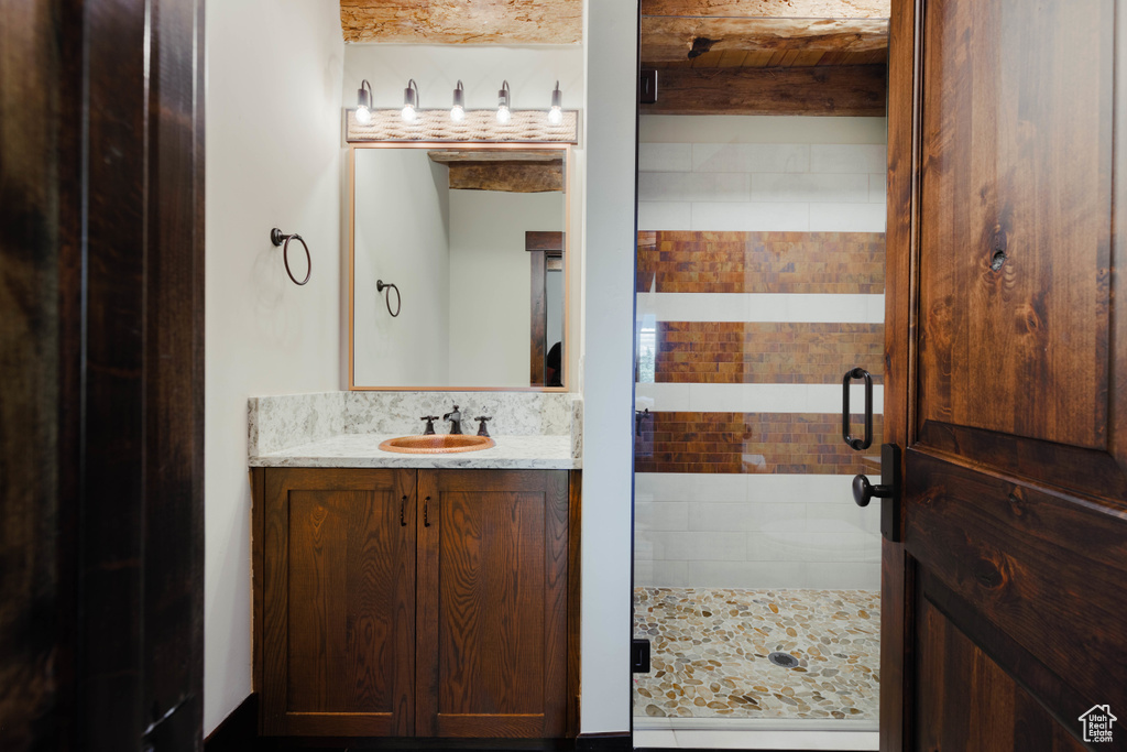 Bathroom with a stall shower and vanity