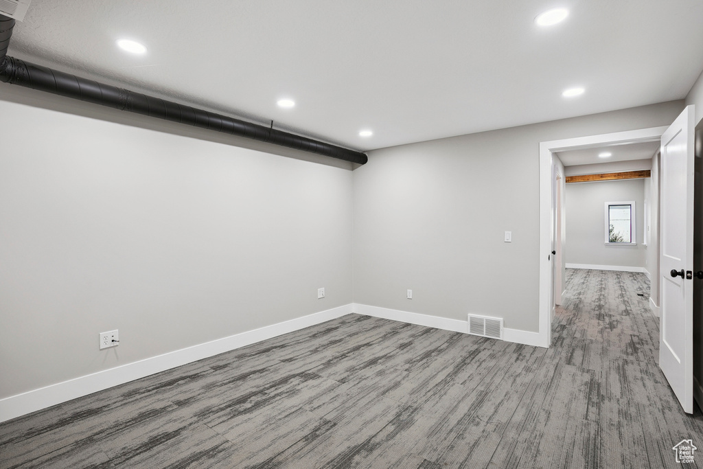 Basement featuring recessed lighting and wood finished floors