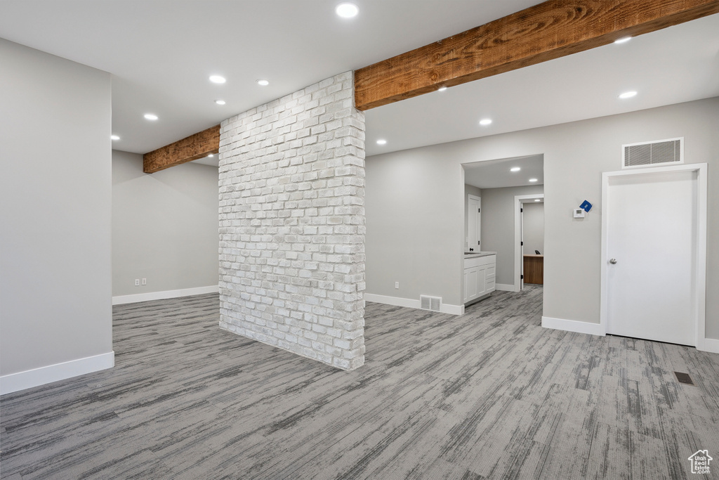 Finished below grade area with recessed lighting and light wood-style floors