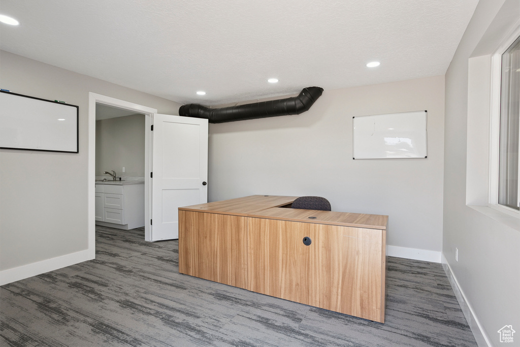 Unfurnished office with wood finished floors and recessed lighting