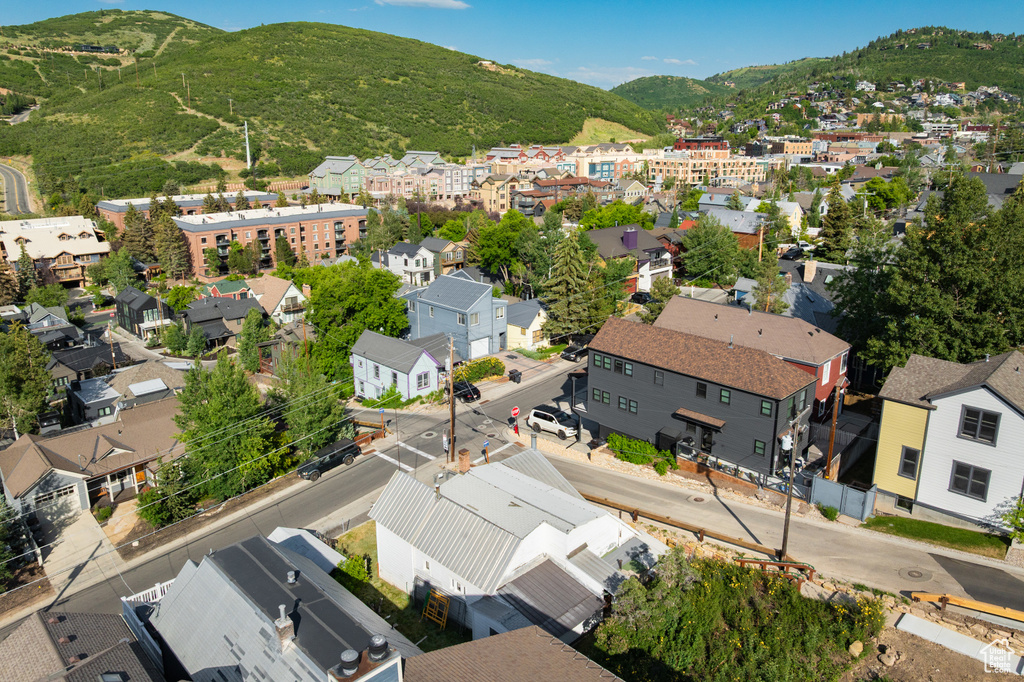 Aerial view of residential area featuring a mountainous background