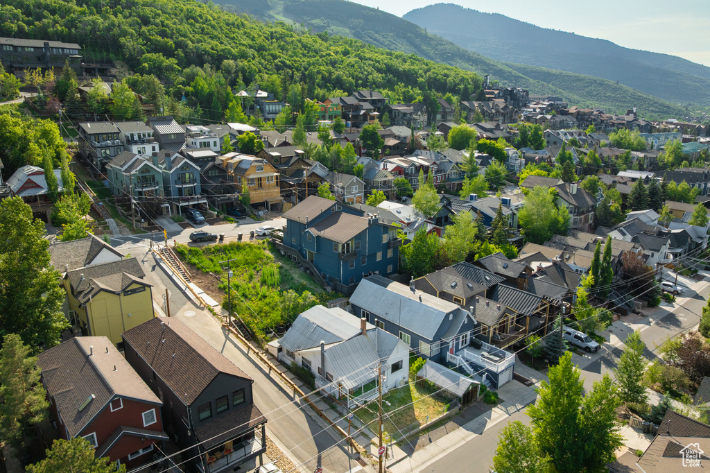 Aerial view of residential area featuring mountains