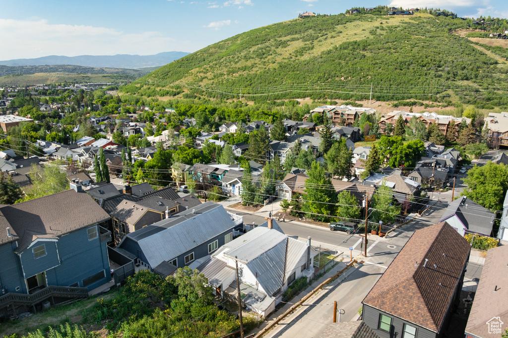 Aerial perspective of suburban area featuring a mountain backdrop